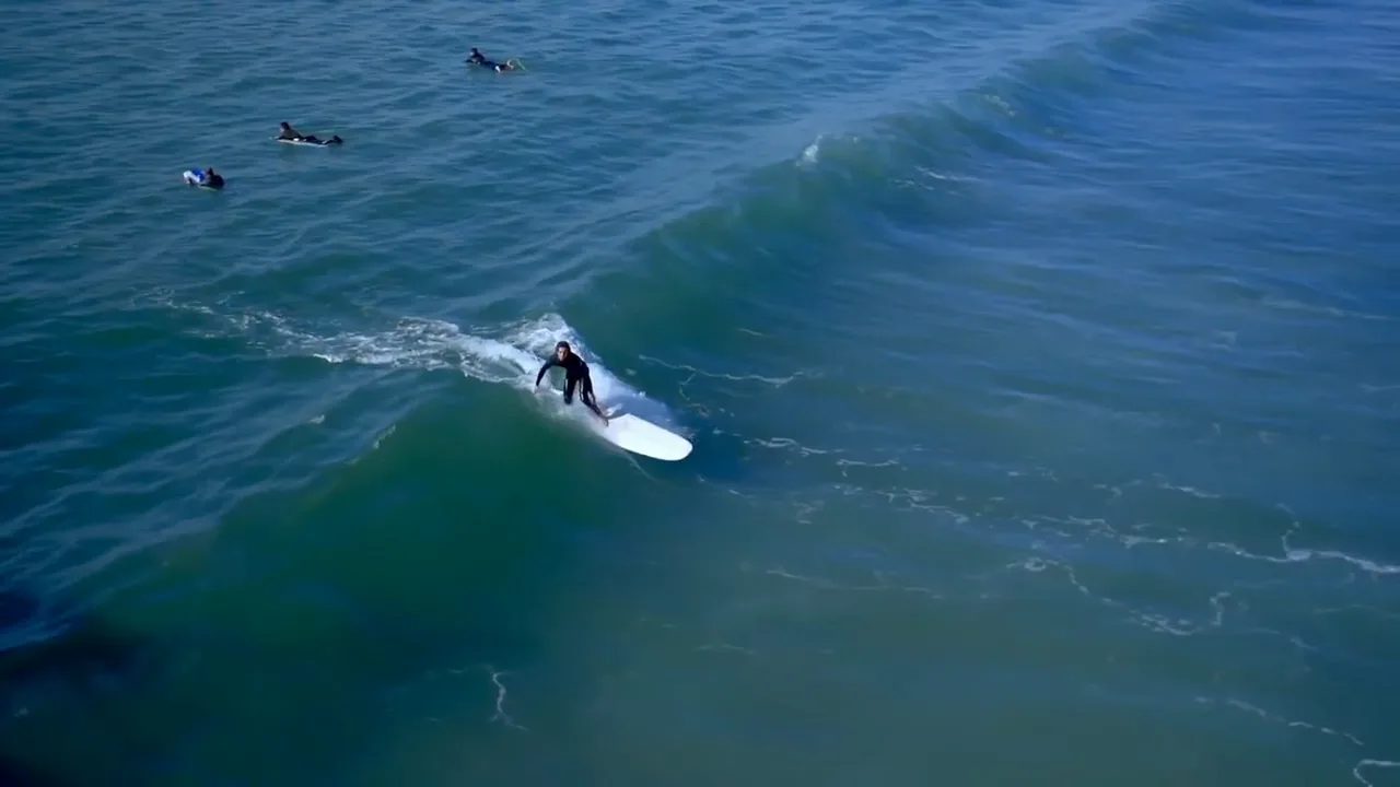 Aerial view of a surfer at Manhattan Beach